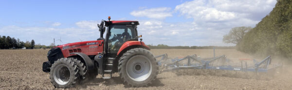 Tractor cultivating ground