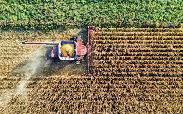 Farm machinery in a field representing machinery insurance values and underinsurance risks